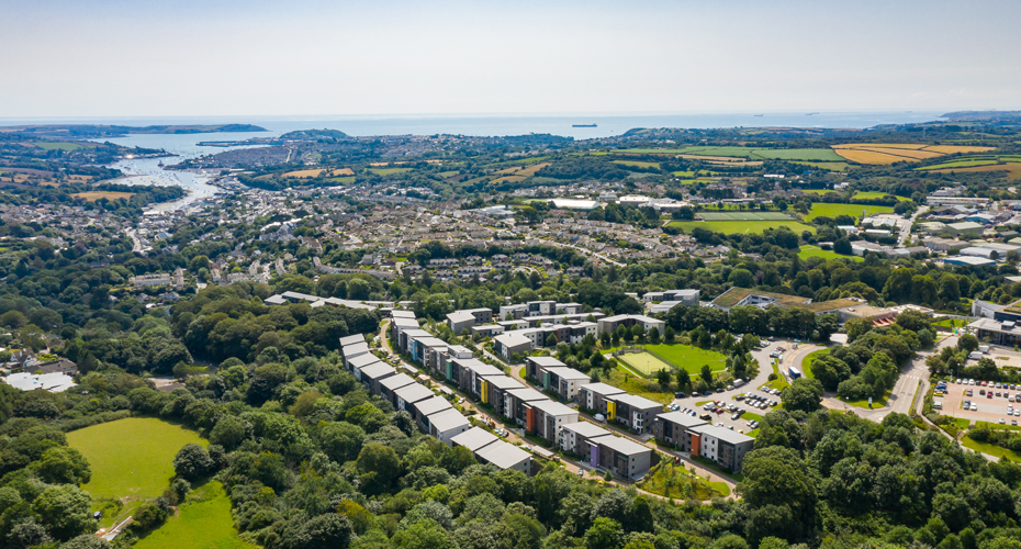 Aerial shot of Penryn campus with sea on horizon