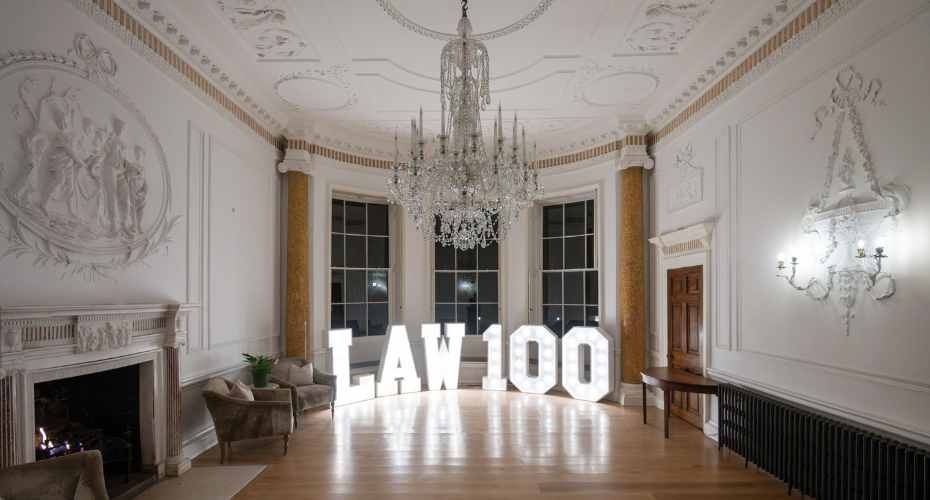 Large room with Law 100 in lit up letters