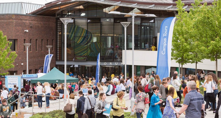 People gathering for an event outside the Forum