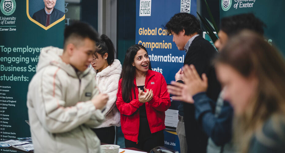 An employer talking to a student at a Careers Fair