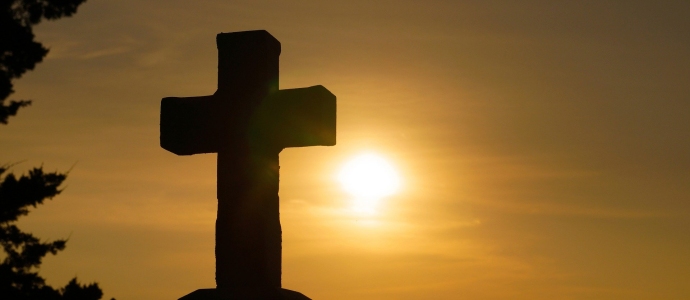 Stone cross in silhouette against the sun. Downloaded from https://pixabay.com/photos/god-religion-cross-christianity-1772560/ 24th November 2020.