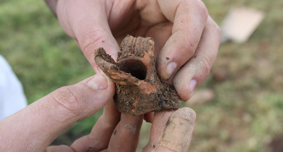 Close up of pottery found on dig