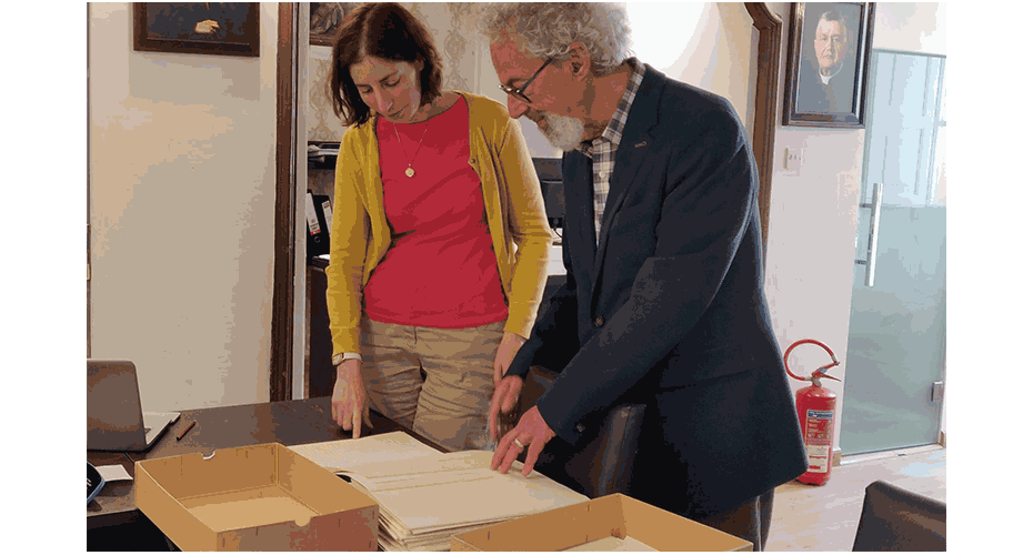 Academics looking at archives