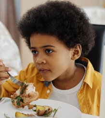 Children eating meat