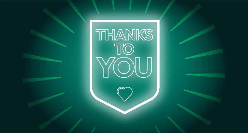 A shield containing the words Thanks to you, and a heart, surrounded by a flare of light
