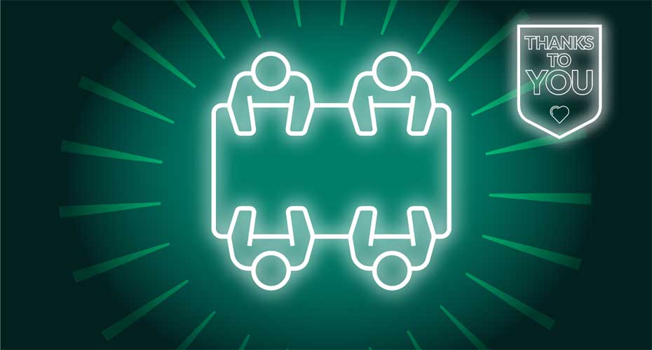 People sitting round a desk icon