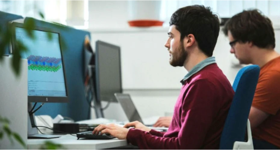 image of a student sat in front of a computer