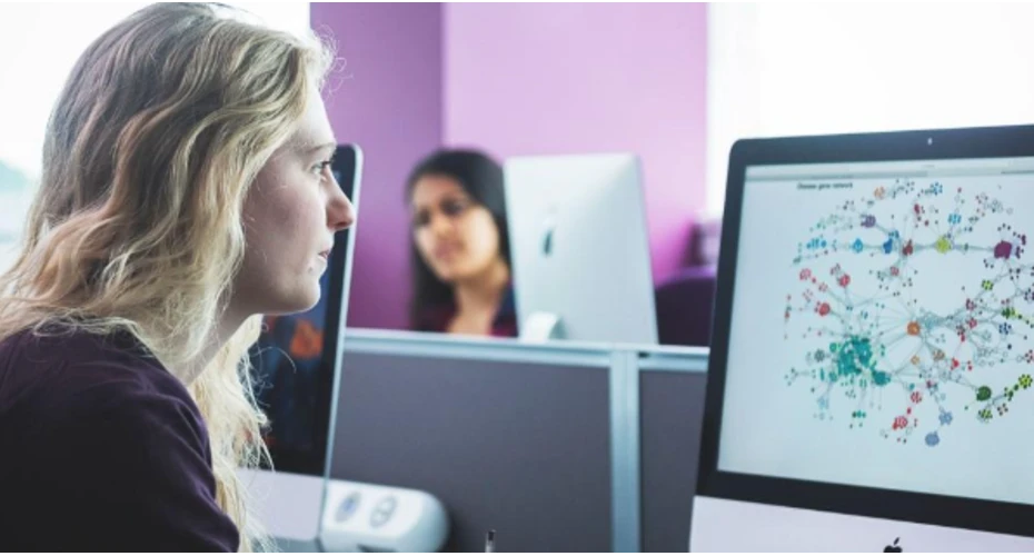 image of a student sat in front of a computer