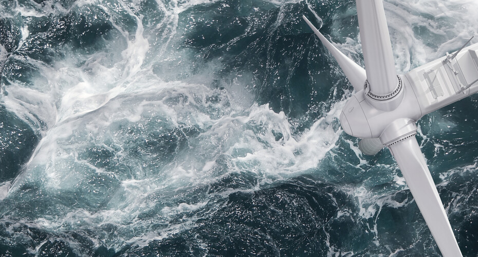 Waves crashing around a wind turbine in the sea, seen from above