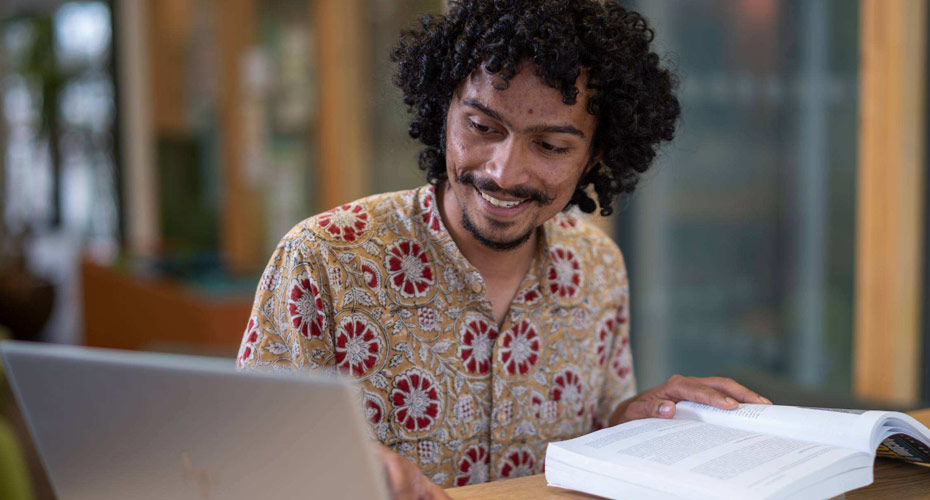 A student working on his laptop