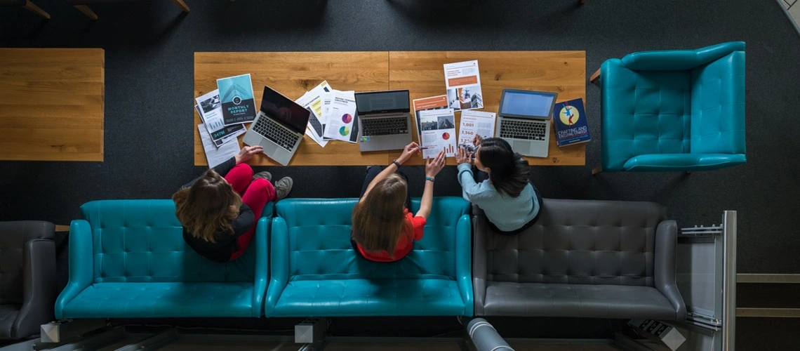 A group of students working together in the Business School at the University of Exeter.