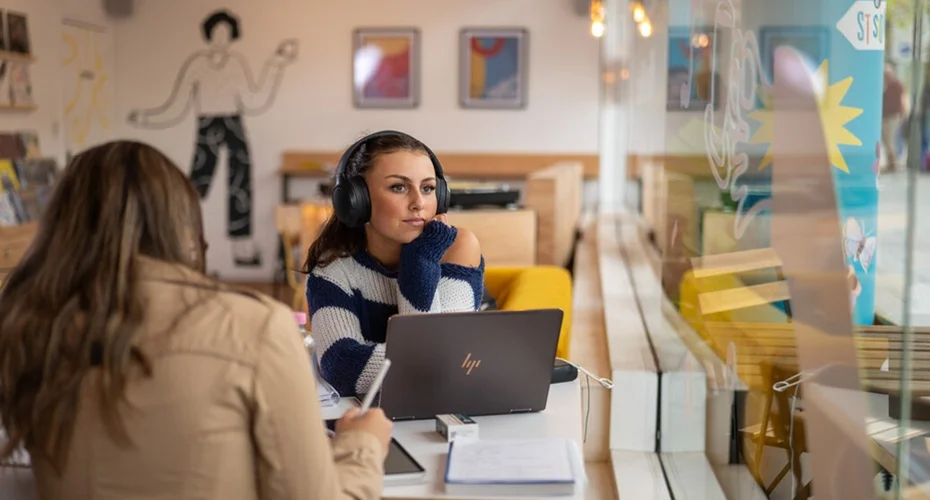 A University of Exeter student studying in a café in the city centre.