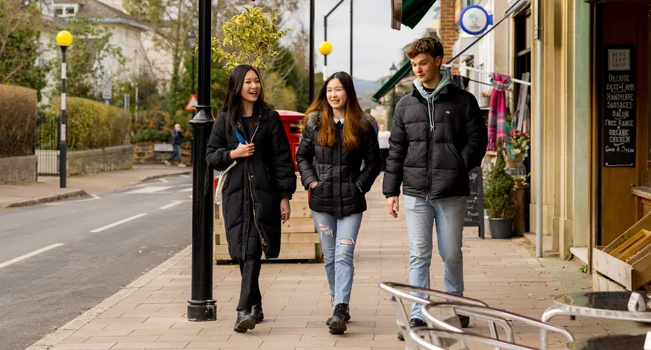 University of Exeter students walking together on Magdalen Road, named one of the ‘10 coolest shopping areas in the whole world’ by The Guardian.