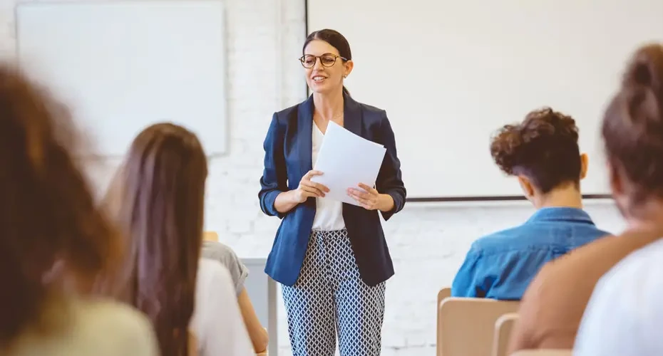 Degree Apprenticeships teacher standing at the front of a classroom of apprentices