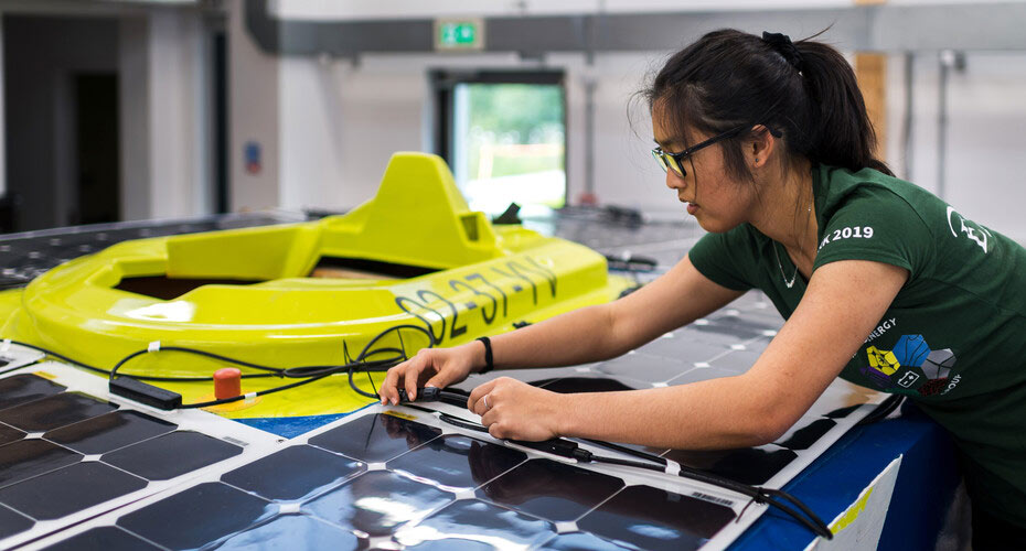 A student working on a solar panel