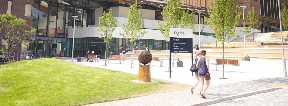 Students walking in front of the Forum on Streatham Campus