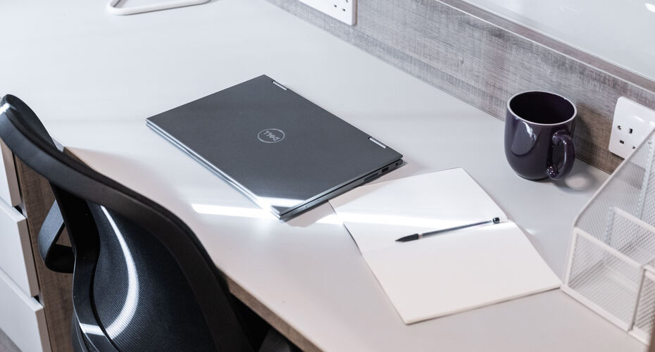 A closed laptop on a desk