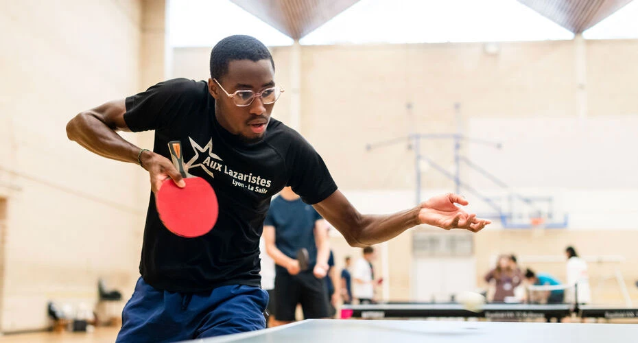 A student playing table tennis