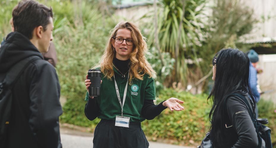 A student talking to prospective students at a Penryn Campus Open Day