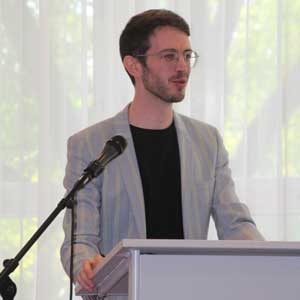 Alberto Cavallarin standing at a podium
