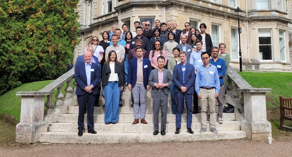 A group of delegates stands on the steps of Reed Hall in Exeter during the 2nd ESF conference.