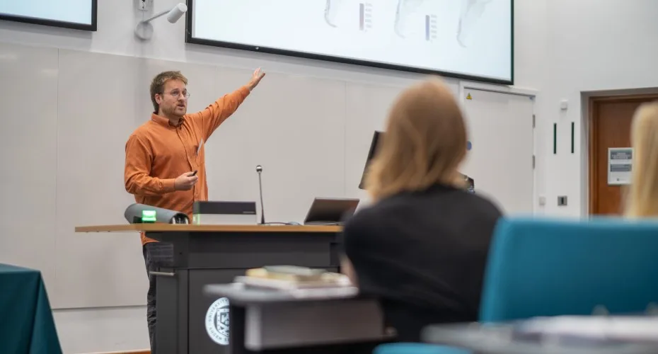 en Balmford, delivers a lecture at the LEEP@10 event in a classroom setting.
