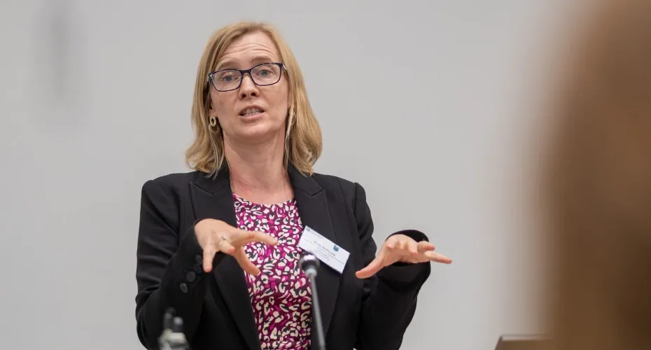 Emily McKenzie speaks at the LEEP@10 event, showcasing her presentation.