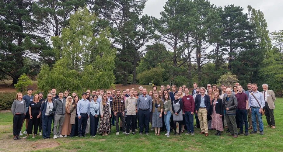 Delegates and speakers pose for a group photo outside the LEEP@10 event at the Streatham campus, Exeter grounds.