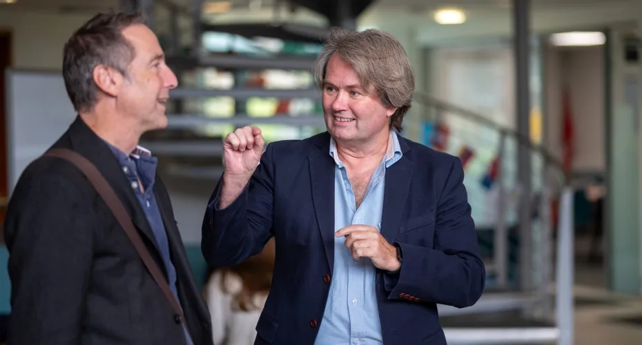 Professor Ian Bateman converses with a delegate at the LEEP@10 event.