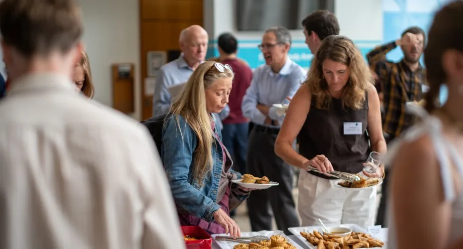 Delegates enjoying lunch together at the LEEP@10 conference, engaging in conversation and networking.