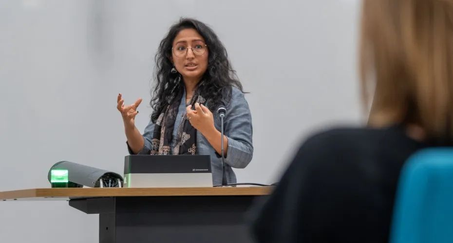 Neha Deopa presenting at the LEEP@10 event to an audience of engaged attendees.