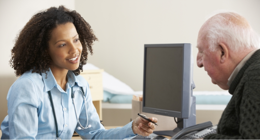A doctor speaking to a patient