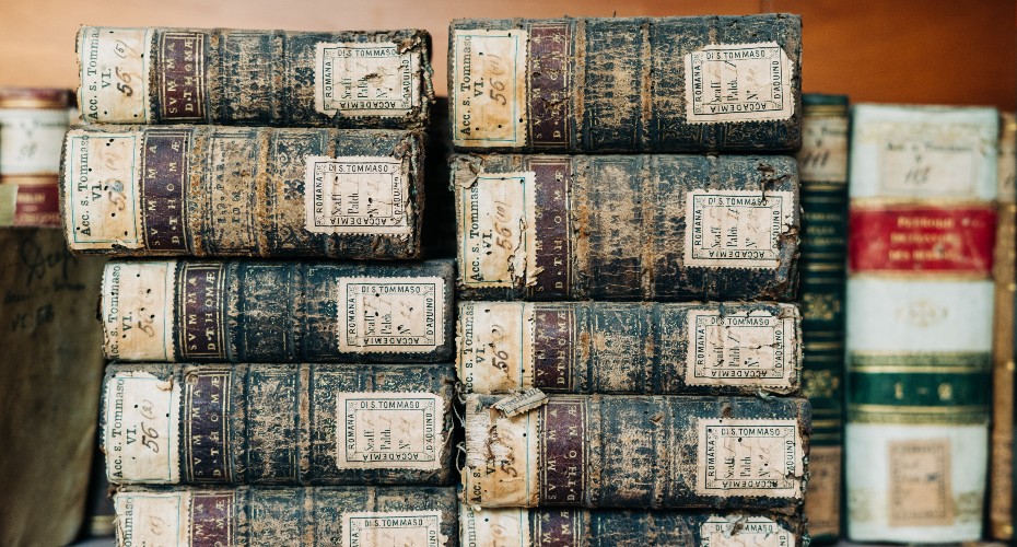 A pile of old books stacked