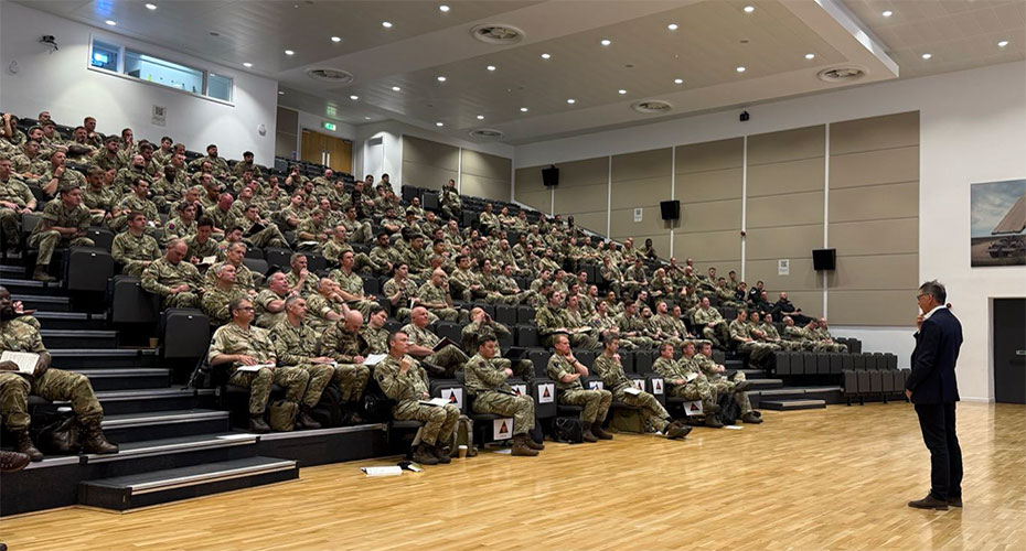 Tony King in a lecture theatre with military personnel