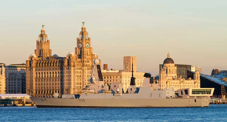 Royal Navy war ship, HMS Dragon, type 45 destroyer, leaving Liverpool, England.