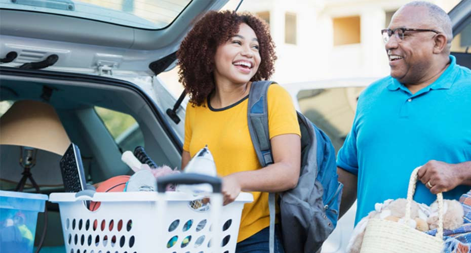 A father drops his daughter off at university