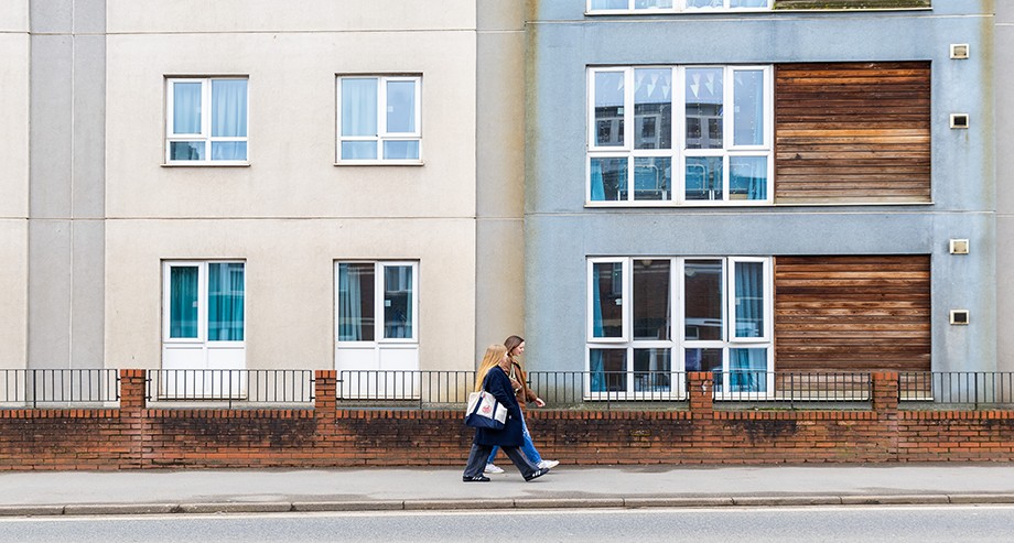 Students walking past Point Exe