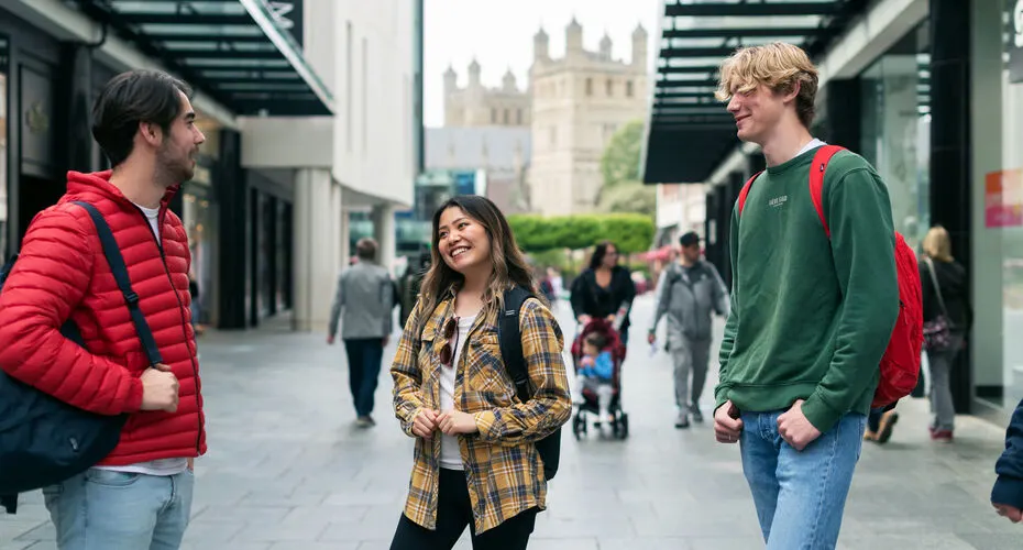 Three students exploring Exeter city centre together.
