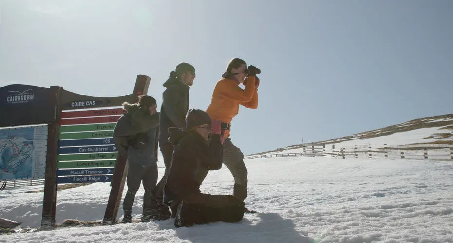 A group of Environmental Science students taking photos on the Scottish field trip.
