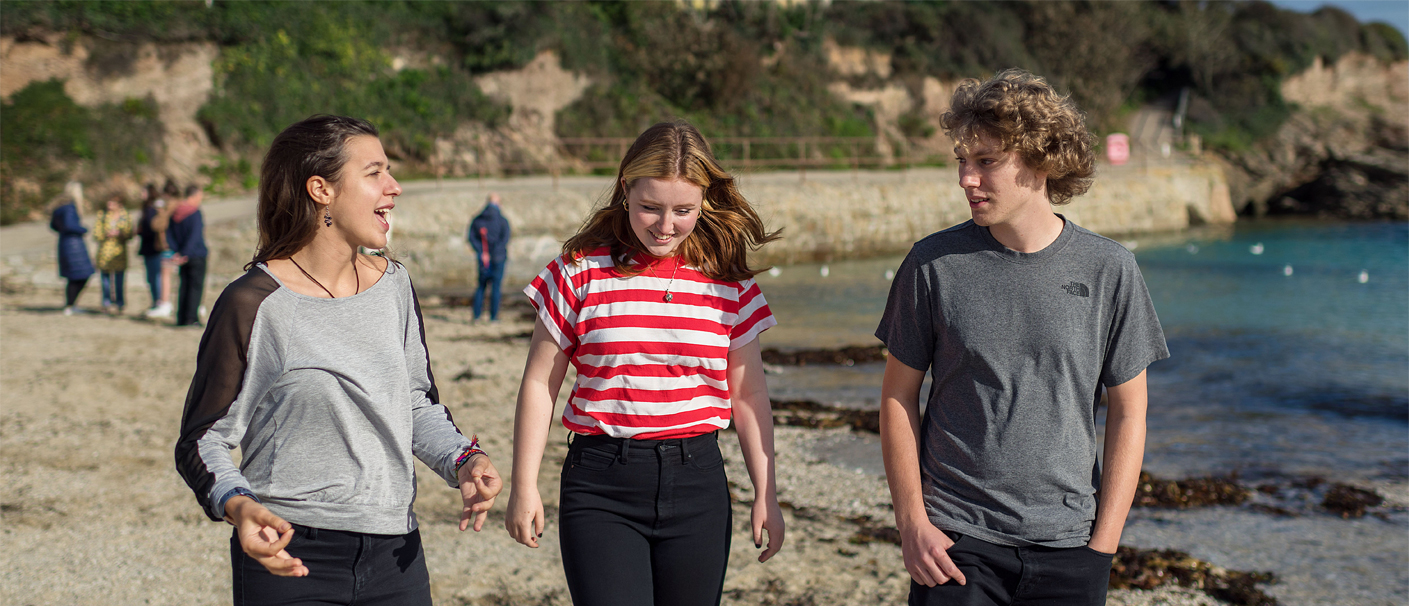 Students on Swanpool beach, Cornwall