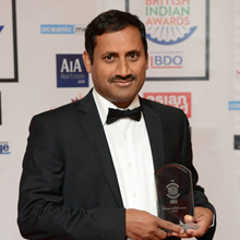 Professor Tapas Mallick holding award