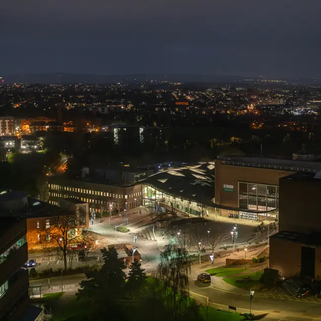 A Birds eye view of the University Forum and Piazza at night.