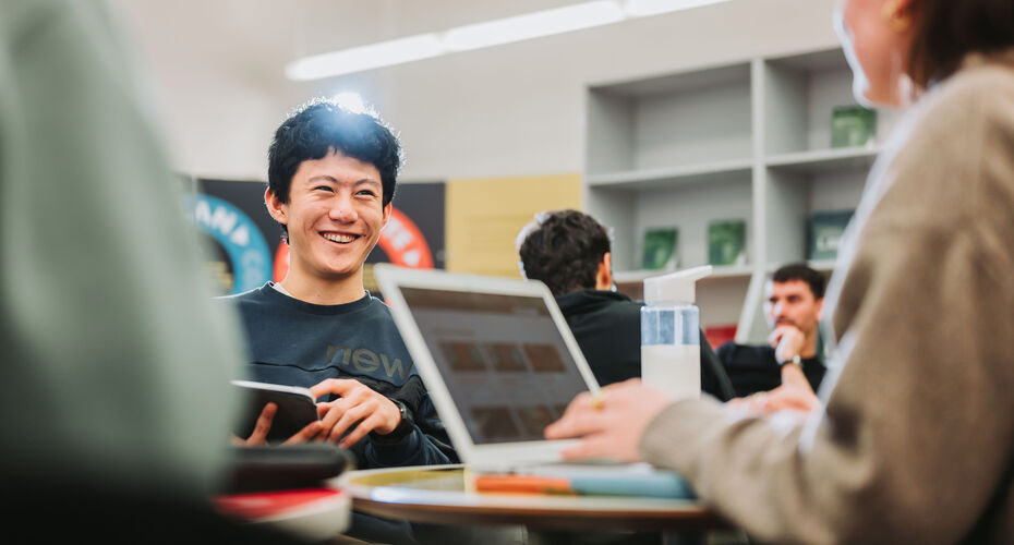 A student talking to an employer