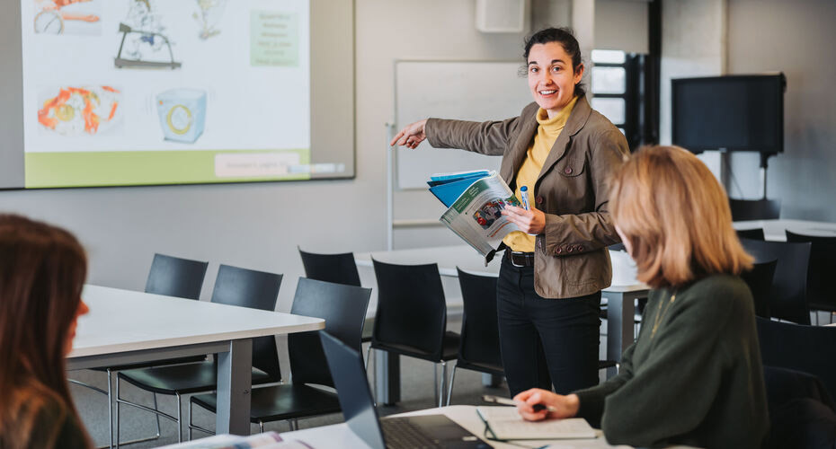 An employer givign a presentation to students about their company