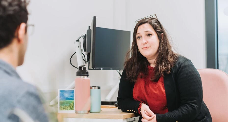 A student talking to an advisor in Wellbeing Services