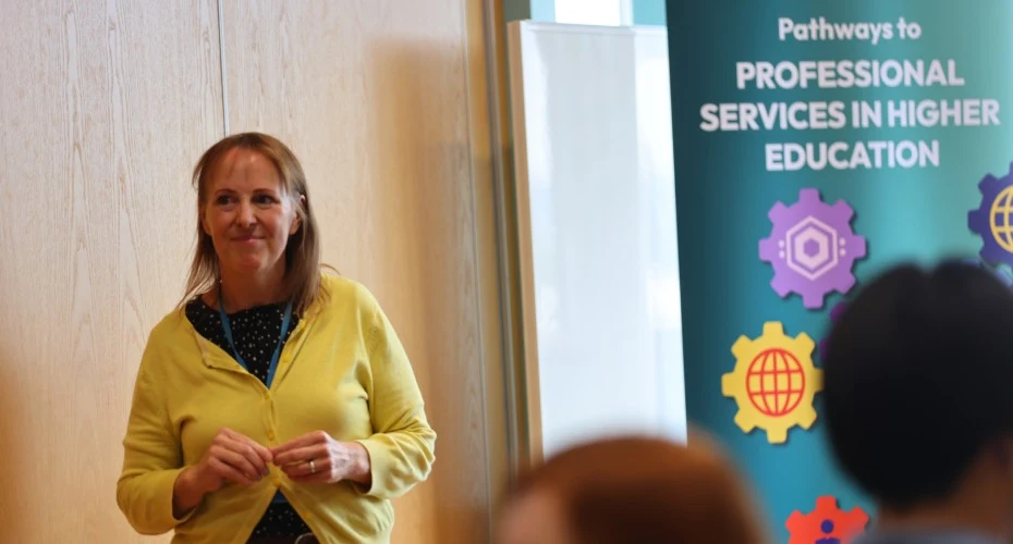 Tutor speaking in front of a group of students