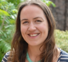 Photo of Hannah Richards with foliage and green leaves in the background