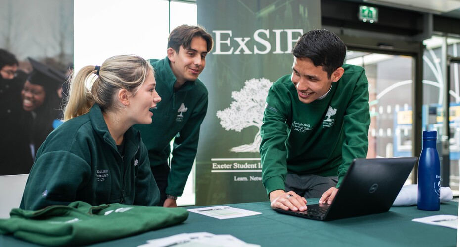 Three students representing an SU society