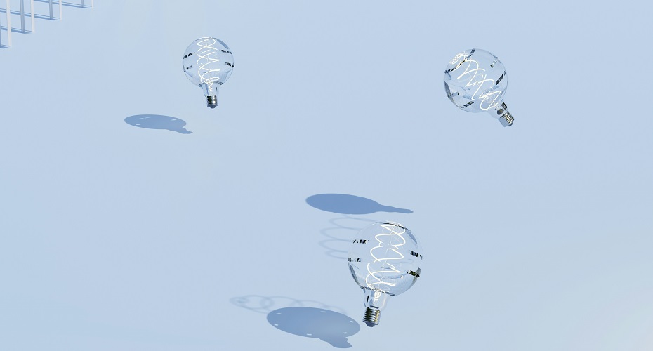 A group of lightbulbs hovering over the ground