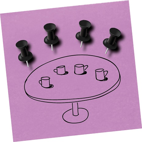 A picture of a meeting made out of stationery